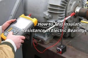 An engineer using a megohmmeter to test the insulation resistance of a large ceramic-coated electric bearing.