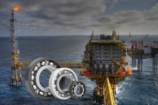 Heavy-duty electric motors installed on an offshore oil platform exposed to salt spray and harsh weather.