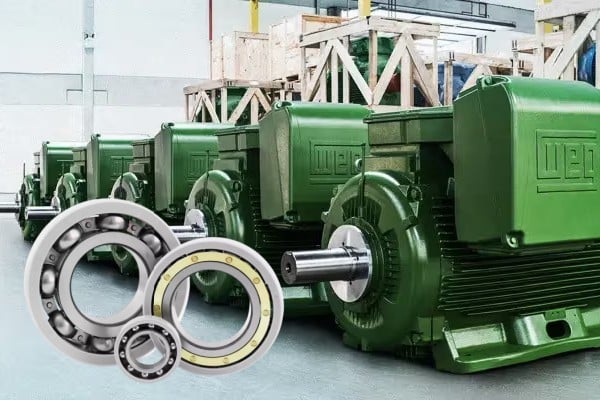 Large industrial electric motor connected to a variable frequency drive system in a factory setting.