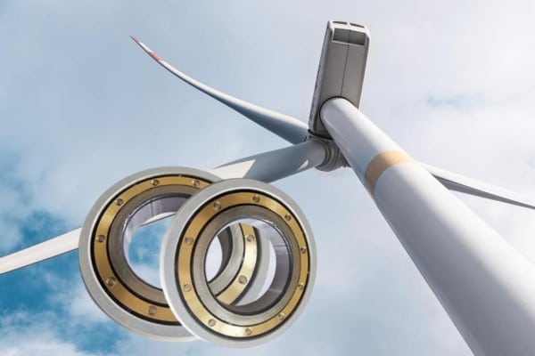 Internal view of a wind turbine nacelle showing the generator and gearbox components requiring electrical insulation.